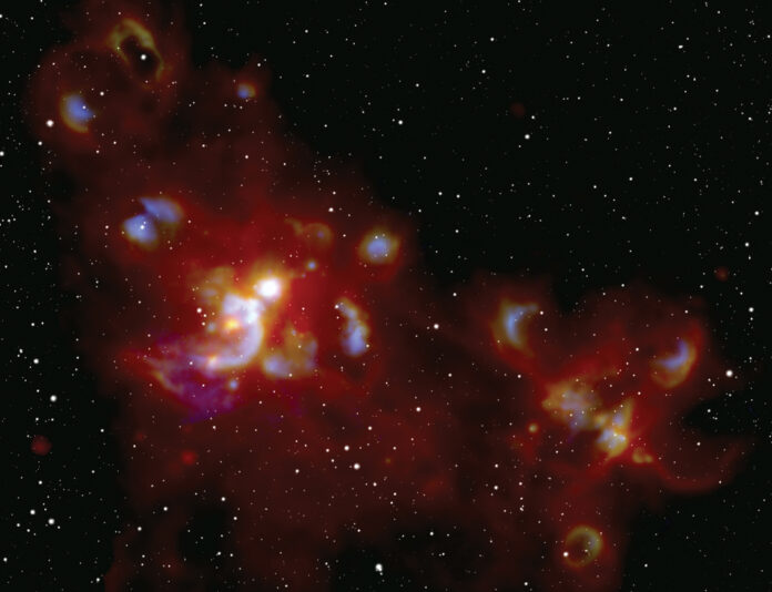 A-NASA-image-of-A-cosmic-light-show-sparked-by-the-formation-of-massive-stars-.jpg